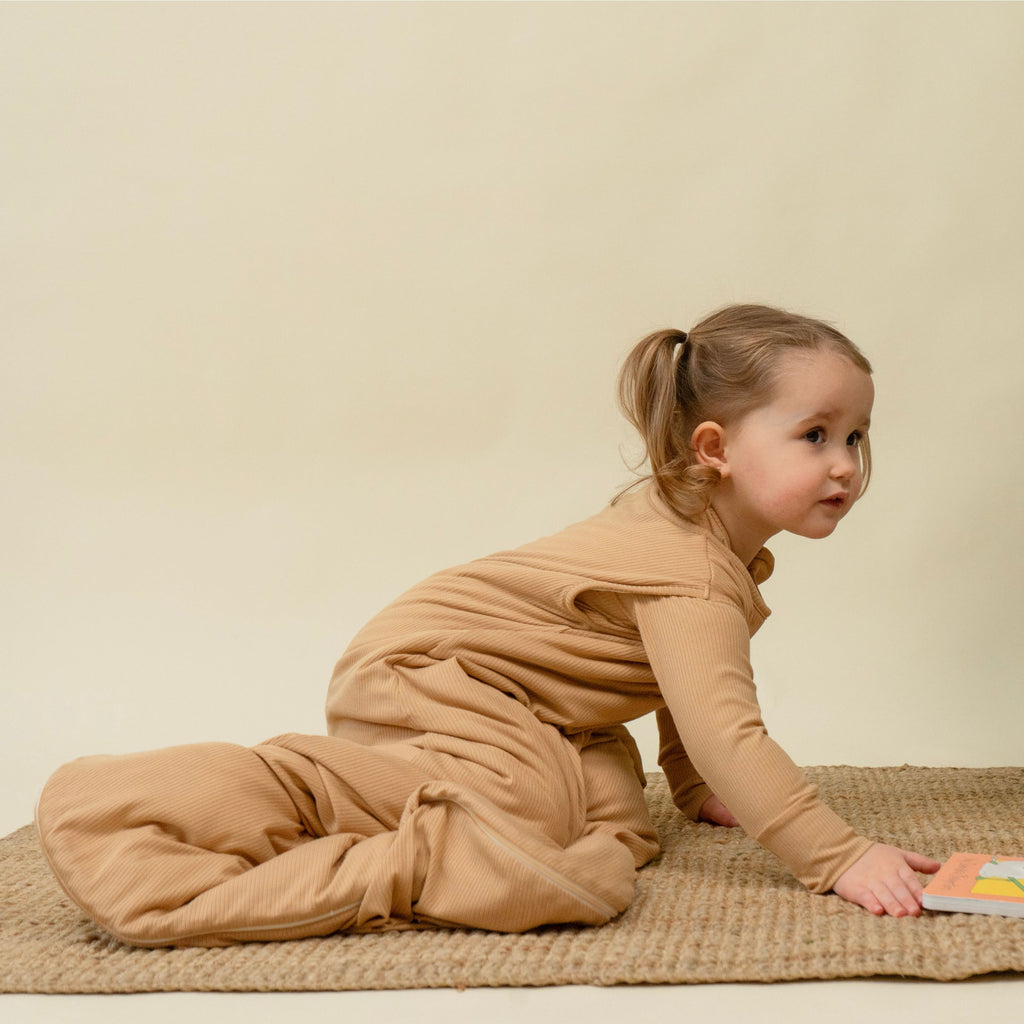 baby wearing ribbed bamboo sleep sack in amber color