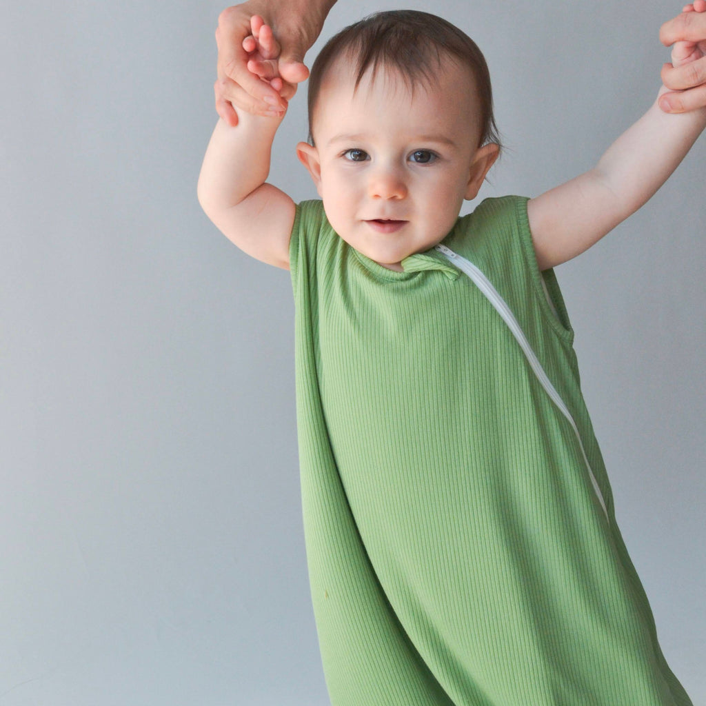 baby wearing ribbed bamboo sleep sack in clover color
