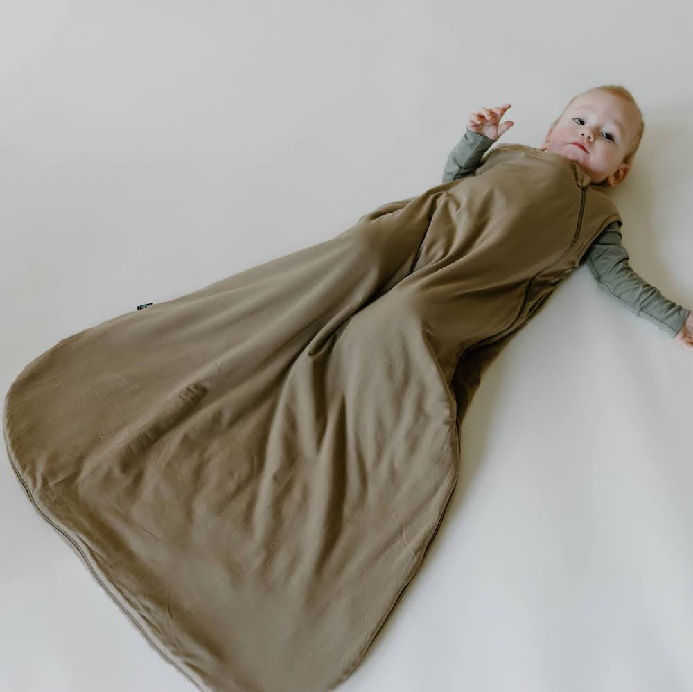 baby wearing bamboo sleep sack in bark solid color